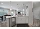 Modern kitchen with stainless steel dishwasher and quartz countertops at 18022 Stark Way, Charlotte, NC 28278