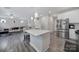 Open kitchen with stainless steel appliances and seamless flow to living area at 18022 Stark Way, Charlotte, NC 28278