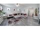 Inviting living room with large sofa and plenty of natural light at 18022 Stark Way, Charlotte, NC 28278