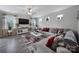 Spacious living room with modern decor, including a large sectional sofa at 18022 Stark Way, Charlotte, NC 28278