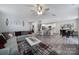 Open-concept living space with seamless transition to kitchen and dining at 18022 Stark Way, Charlotte, NC 28278