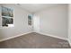 Simple bedroom with neutral walls and carpeted flooring at 2120 Golfcrest Dr, Kannapolis, NC 28081