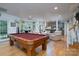 Basement rec room with pool table and access to backyard at 234 Glenbrook Springs None, New London, NC 28127