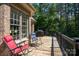 Relaxing deck with chairs overlooking the backyard at 234 Glenbrook Springs None, New London, NC 28127