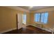 Spacious bedroom with hardwood floors and window coverings at 301 W 10Th W St # 101, Charlotte, NC 28202