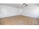 Bright hallway with light hardwood floors and access to bedrooms at 310 W 4Th Ave, Gastonia, NC 28052