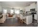 Modern kitchen with white cabinets, granite island, and stainless steel appliances at 318 Willow Wood Ct, Matthews, NC 28104