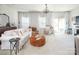 Bright living room with comfy seating, large windows, and a cozy atmosphere at 318 Willow Wood Ct, Matthews, NC 28104