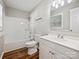 Updated bathroom with white vanity, tub shower combo, and wood-look flooring at 350 Orr Dr, Rock Hill, SC 29730