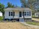 Updated bungalow with front porch, landscaping, and a gray gravel driveway at 350 Orr Dr, Rock Hill, SC 29730