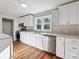 Modern kitchen with white cabinets, stainless steel appliances, and wood flooring at 350 Orr Dr, Rock Hill, SC 29730