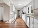 Modern kitchen with white cabinets, stainless steel appliances, and wood flooring at 350 Orr Dr, Rock Hill, SC 29730