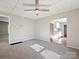 Bright living room features neutral walls, ceiling fan, and access to kitchen at 350 Orr Dr, Rock Hill, SC 29730
