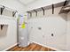 Utility closet with water heater, shelving and wood-look flooring at 350 Orr Dr, Rock Hill, SC 29730