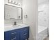 Stylish bathroom with blue vanity and geometric tile at 3722 Unionville Indian Trail W Rd, Indian Trail, NC 28079