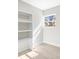 Simple bedroom with built-in shelving and a window offering natural light at 3722 Unionville Indian Trail W Rd, Indian Trail, NC 28079