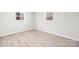 Simple bedroom with light walls and wood-look flooring at 3722 Unionville Indian Trail W Rd, Indian Trail, NC 28079