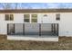 Rear view of home, showcasing modern deck and fence at 3722 Unionville Indian Trail W Rd, Indian Trail, NC 28079