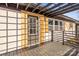 Modern front door with wood accents and pergola overhead at 3722 Unionville Indian Trail W Rd, Indian Trail, NC 28079