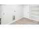 Laundry room with built-in shelving and a washer and dryer hookup at 3722 Unionville Indian Trail W Rd, Indian Trail, NC 28079