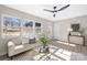 Spacious living room with light beige couch, coffee table, and lots of natural light at 3722 Unionville Indian Trail W Rd, Indian Trail, NC 28079