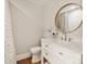 Modern bathroom with white vanity, round mirror, and geometric patterned shower curtain at 424 Fairhaven Ct, Waxhaw, NC 28173