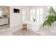 Spa-like bathroom with a freestanding tub and large windows at 424 Fairhaven Ct, Waxhaw, NC 28173