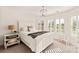 Charming bedroom with white furniture and plantation shutters at 424 Fairhaven Ct, Waxhaw, NC 28173