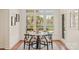 Charming breakfast nook with a round table and chairs, overlooking a lake at 424 Fairhaven Ct, Waxhaw, NC 28173