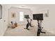 Home gym featuring two Peloton bikes and plenty of space for a workout at 424 Fairhaven Ct, Waxhaw, NC 28173