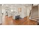 Modern kitchen with island, white cabinets, and hardwood floors at 424 Fairhaven Ct, Waxhaw, NC 28173