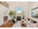 Spacious living room with high ceilings, fireplace and lake view at 424 Fairhaven Ct, Waxhaw, NC 28173