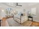 Luxurious main bedroom with a large window, high ceilings, and plush bedding at 424 Fairhaven Ct, Waxhaw, NC 28173