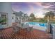 Brick patio with outdoor dining set, adjacent to pool at 424 Fairhaven Ct, Waxhaw, NC 28173