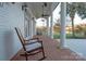 Brick porch with rocking chairs and lake view at 424 Fairhaven Ct, Waxhaw, NC 28173