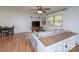 Living room with gray sofa, wood floors, and built-in shelving at 5260 Nc Hwy 73 Hwy, Iron Station, NC 28080