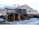 Back exterior view showcasing a raised deck and screened porch at 5360 Creekwood Dr, Salisbury, NC 28147