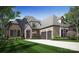 Brick home with a 2-car garage and manicured lawn at 613 Deodar Cedar Dr, Weddington, NC 28104