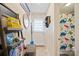 Bathroom with dinosaur shower curtain and access to exterior at 625 N 3Rd St, Albemarle, NC 28001