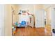 bedroom with dinosaur theme, wooden floors, and toy storage at 625 N 3Rd St, Albemarle, NC 28001