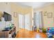 bedroom with TV, toy storage, and hardwood floors at 625 N 3Rd St, Albemarle, NC 28001