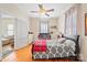 Bedroom with double bed, crib, and access to another room at 625 N 3Rd St, Albemarle, NC 28001