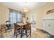 Cozy dining area featuring a square table and hardwood floors at 625 N 3Rd St, Albemarle, NC 28001