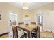 Charming dining room with hardwood floors and a marble-top table at 625 N 3Rd St, Albemarle, NC 28001