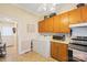 Kitchen with appliances, laundry, and access to exterior at 625 N 3Rd St, Albemarle, NC 28001