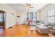 Living room features hardwood floors, a sectional sofa, and ample natural light at 625 N 3Rd St, Albemarle, NC 28001