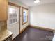 Cozy dining area with wood-trimmed windows and access to backyard at 638 Chipley Ave # 6, Charlotte, NC 28205