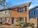 Brick and gray siding townhouse with landscaping at 638 Chipley Ave # 6, Charlotte, NC 28205