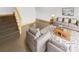 Virtually staged living room with modern furniture and stairs at 638 Chipley Ave # 6, Charlotte, NC 28205