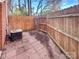 Small patio area with wood fence and AC unit at 638 Chipley Ave # 6, Charlotte, NC 28205